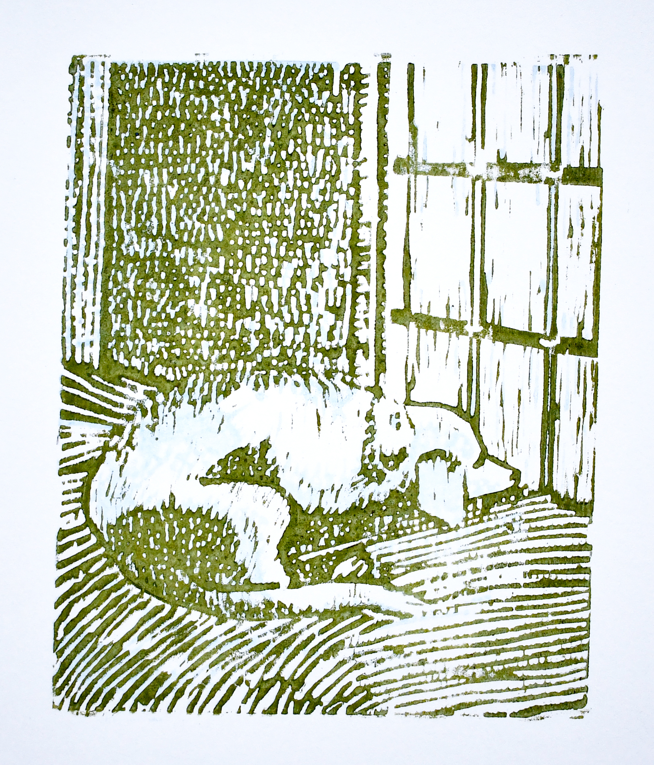 green and blue woodcut art print in a dog lying on a beg looking out the window